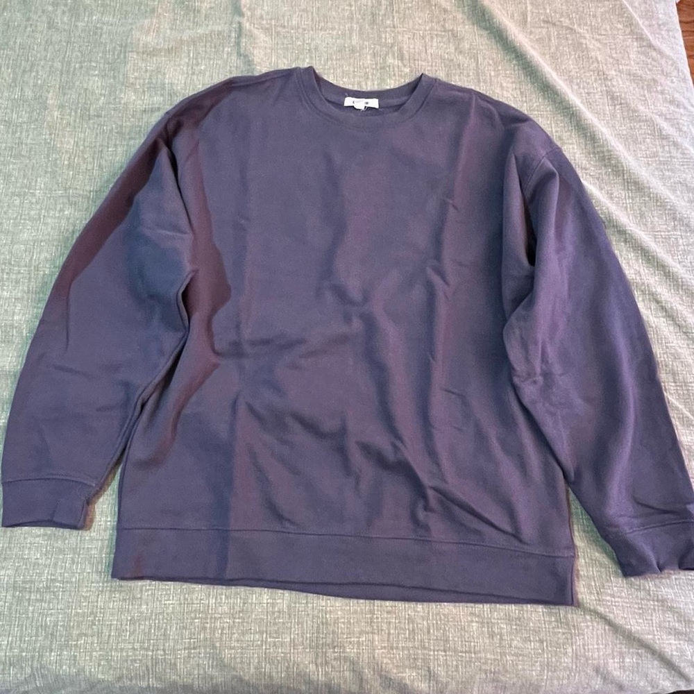 Grayish sweater. Fits a small